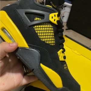 There black and yellow Jordan 4s I’m trying to sell them I really need the money